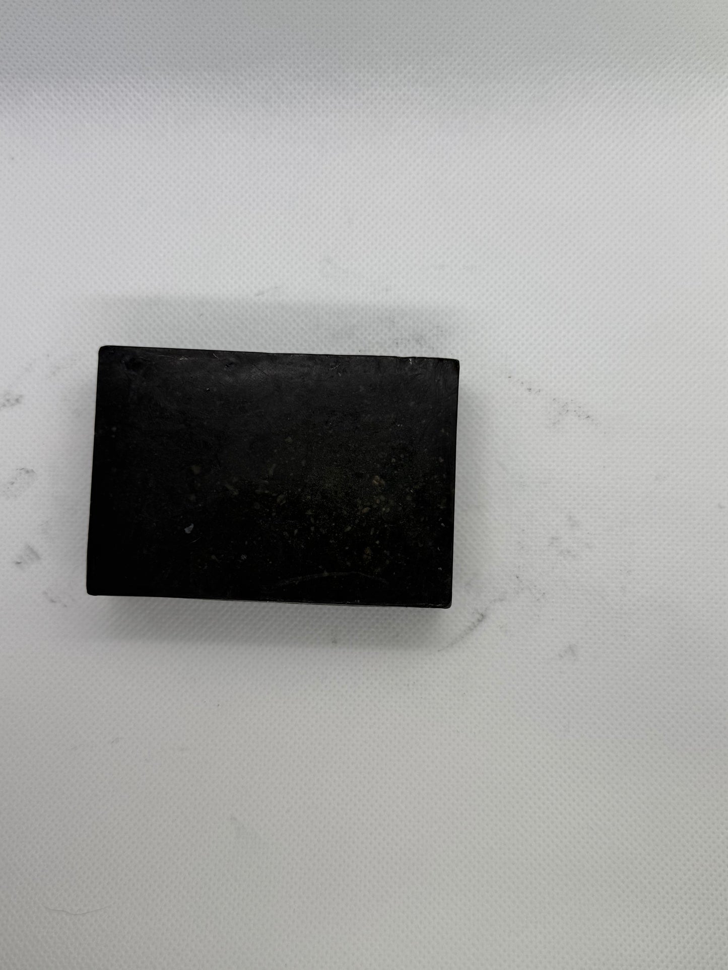 Exfoliating soap bar with a sandalwood scent